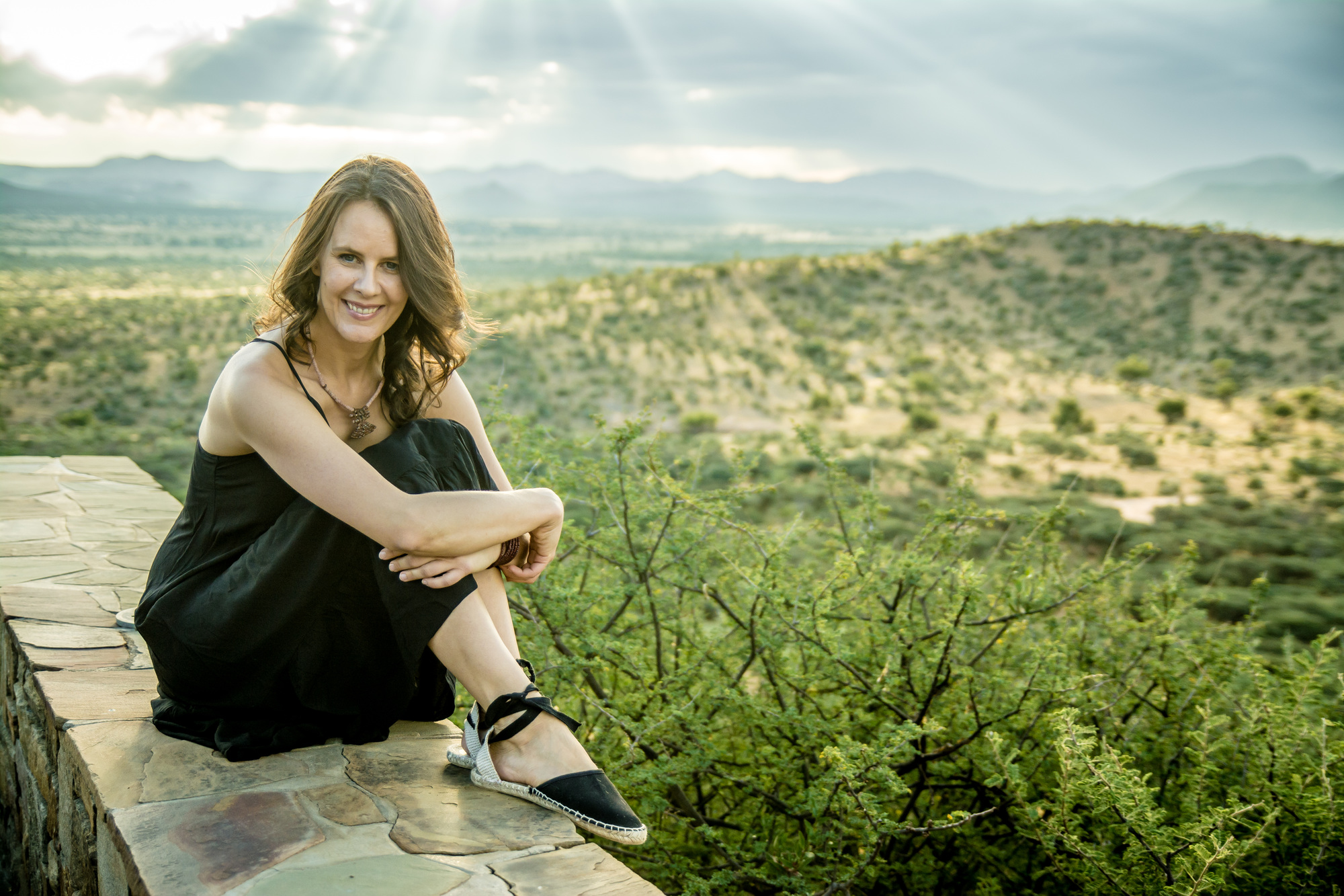 Jani Sophia Schneider overlooking a natural landscape